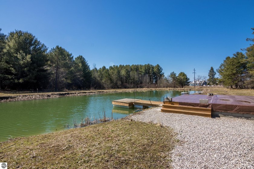 Located between Lake Michigan and Torch Lake sits this little - Beach Acreage for sale in Kewadin, Michigan on Beachhouse.com