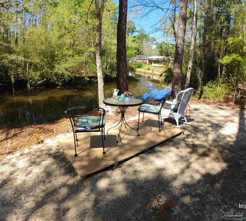 Waterfront lot with unfinished cottage. On Bayou with access to - Beach Lot for sale in Milton, Florida on Beachhouse.com
