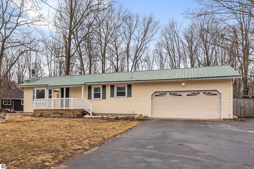 Conveniently located in Canterbury Woods with easy access to - Beach Home for sale in Traverse City, Michigan on Beachhouse.com
