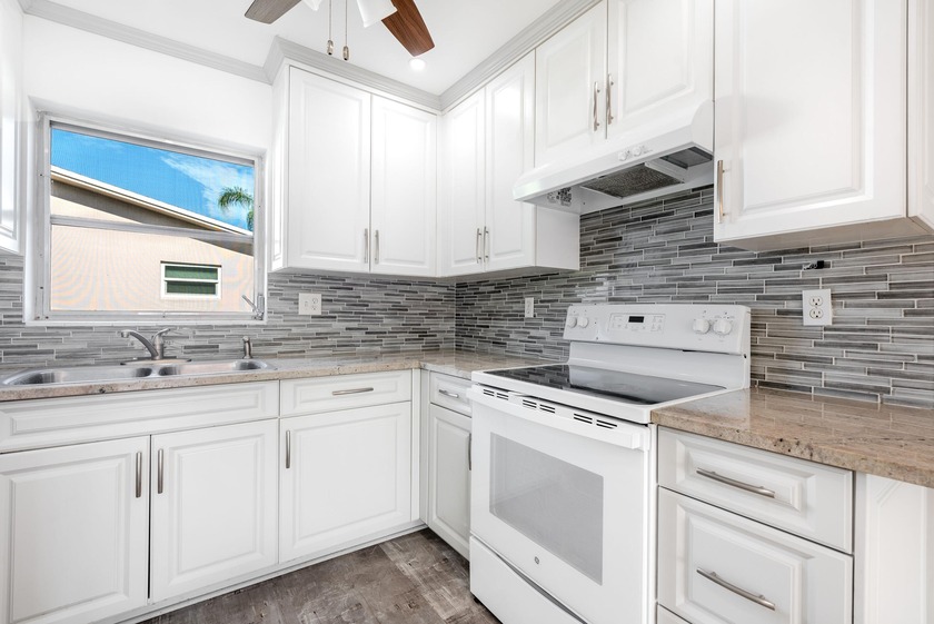 Elevated Florida Living Awaits! This exquisite 2BR, 1.5BA villa - Beach Condo for sale in West Palm Beach, Florida on Beachhouse.com