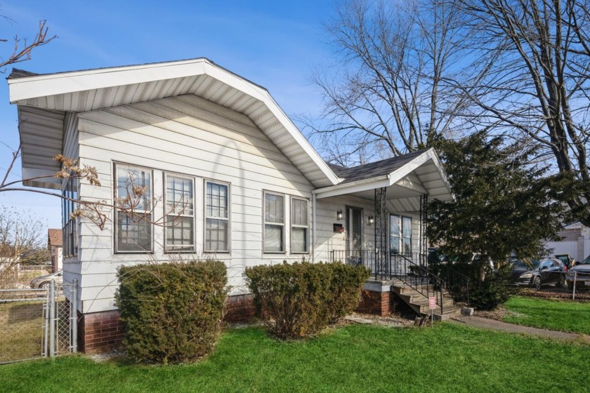 Step into a world of timeless elegance with this charming corner - Beach Home for sale in Michigan City, Indiana on Beachhouse.com