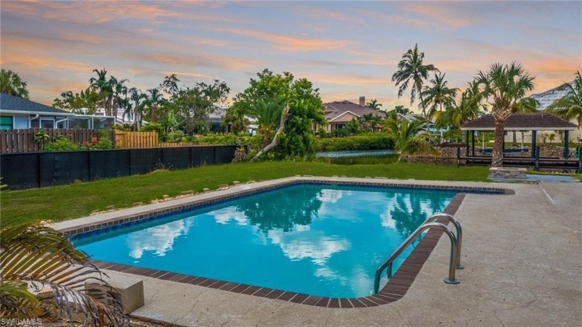 With nearly 130 feet along the Ten Mile Canal, this property - Beach Home for sale in Fort Myers, Florida on Beachhouse.com