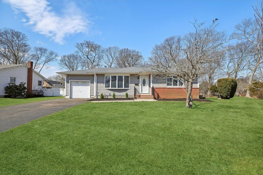 This 3-bedroom home offers a perfect blend of modern updates and - Beach Home for sale in Bellport, New York on Beachhouse.com
