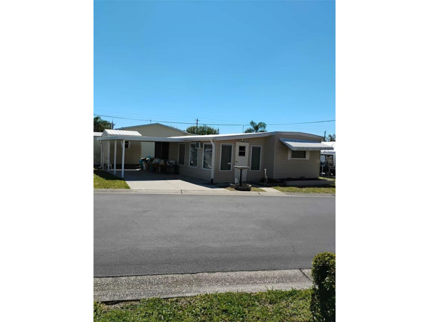 Discover this move-in ready, mostly furnished mobile home in the - Beach Home for sale in Ellenton, Florida on Beachhouse.com