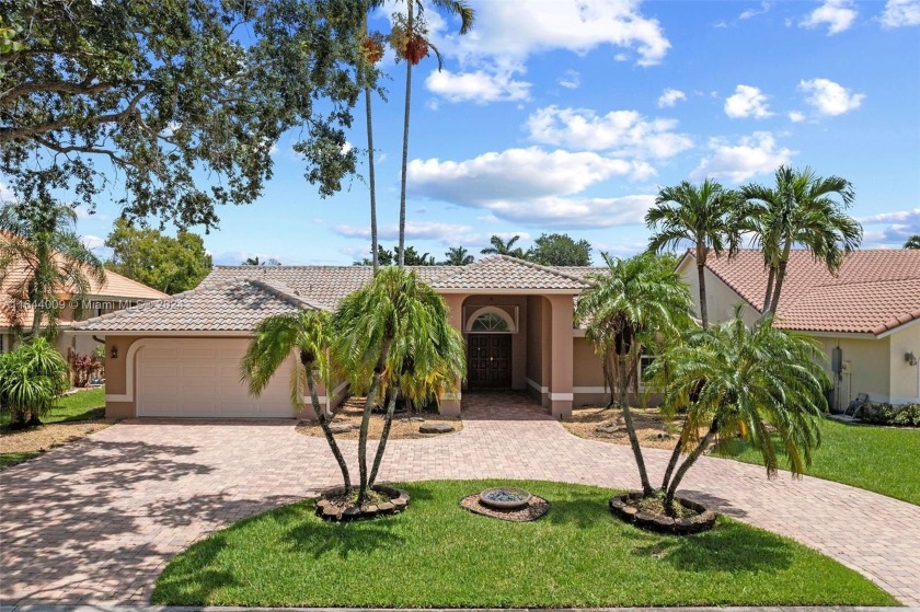 Enjoy serene water and pool views from all the living areas in - Beach Home for sale in Coral Springs, Florida on Beachhouse.com