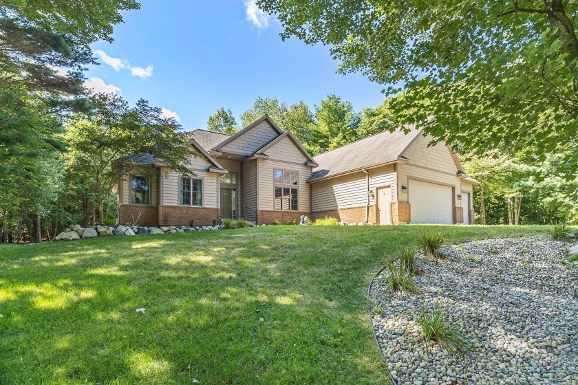 Nestled in a highly sought-after neighborhood, this beautiful - Beach Home for sale in Norton Shores, Michigan on Beachhouse.com