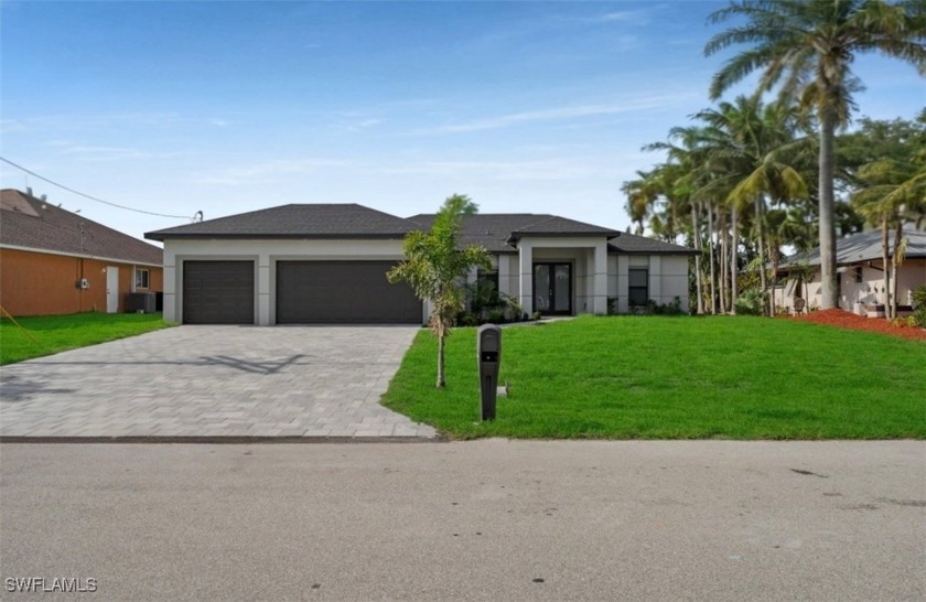 Looking for a home with a pool, canal access, and a THREE car - Beach Home for sale in Cape Coral, Florida on Beachhouse.com