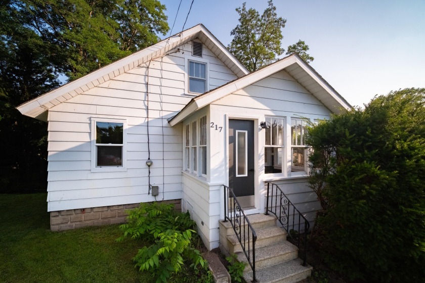 Welcome home to 217 Parkdale Avenue, where classic craftsmanship - Beach Home for sale in Manistee, Michigan on Beachhouse.com