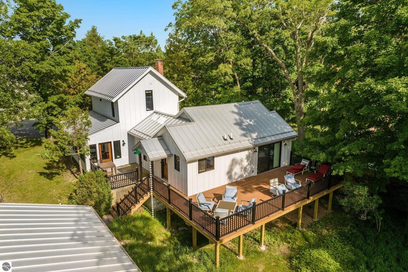 Set on 2.38 private acres with 127 feet of frontage on South Bar - Beach Home for sale in Empire, Michigan on Beachhouse.com