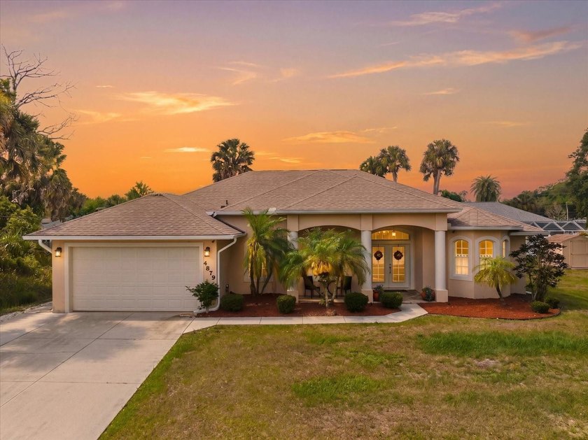 Set on a rare double lot, this Gorgeous Mediterranean-inspired - Beach Home for sale in North Port, Florida on Beachhouse.com