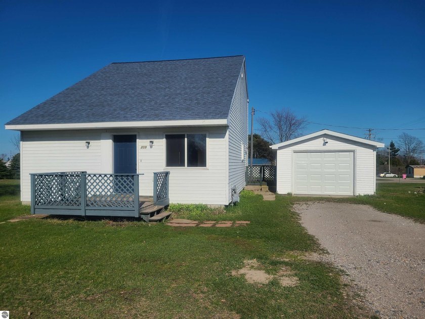 Charming and move-in ready 2-story home situated on a spacious - Beach Home for sale in Oscoda, Michigan on Beachhouse.com