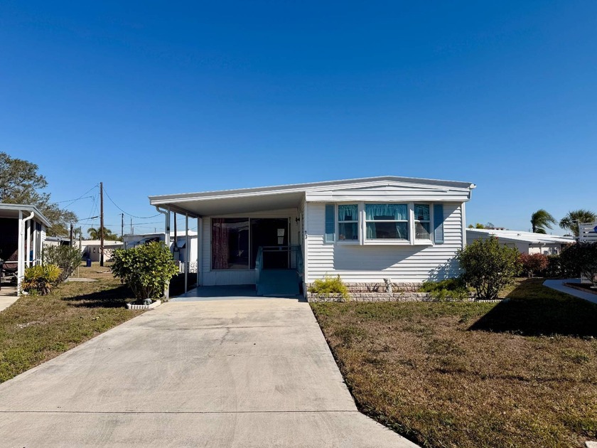 Welcome to this charming 1979 mobile home nestled in the - Beach Home for sale in Palmetto, Florida on Beachhouse.com