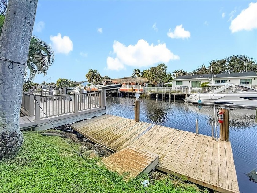 Waterfront living at its finest with a DEEDED DOCK! This - Beach Condo for sale in Pompano Beach, Florida on Beachhouse.com