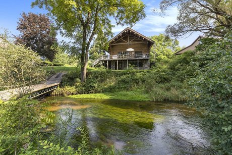 Beautiful Log home with 197 ft of frontage on the Pentwater - Beach Home for sale in Pentwater, Michigan on Beachhouse.com