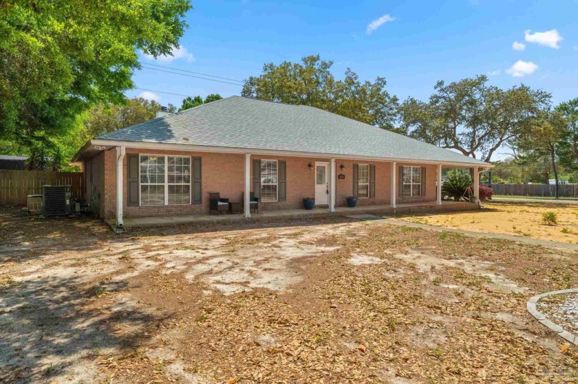 Welcome to this charming 4 bedroom/3 bath home nestled on a - Beach Home for sale in Gulf Breeze, Florida on Beachhouse.com