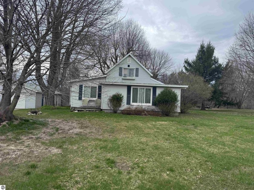 Location is key with this 4 bedroom country home, a 3 car garage - Beach Home for sale in Williamsburg, Michigan on Beachhouse.com