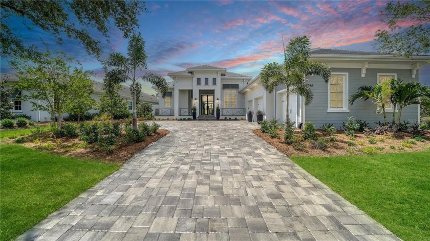 Set in the prestigious Phase 1 section of The Lake Club, this - Beach Home for sale in Lakewood Ranch, Florida on Beachhouse.com