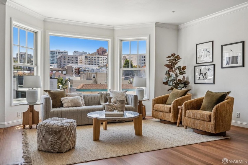 Light pours through oversized bay windows in this top-floor Cow - Beach Condo for sale in San Francisco, California on Beachhouse.com