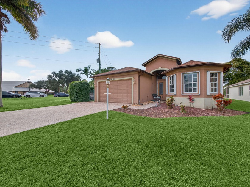 Discover this beautifully maintained 3-bedroom, 2-bath home with - Beach Home for sale in Stuart, Florida on Beachhouse.com