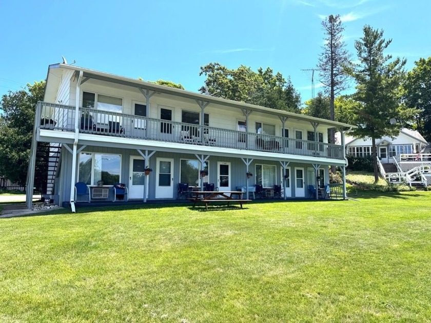 Take refuge in this unique waterfront crash-pad with a 25' pier - Beach Condo for sale in Gills Rock, Wisconsin on Beachhouse.com