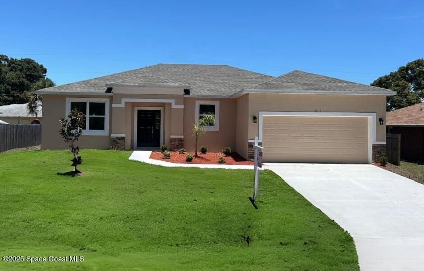 Stunning, custom-built home in NE Palm Bay, featuring tray - Beach Home for sale in Palm Bay, Florida on Beachhouse.com