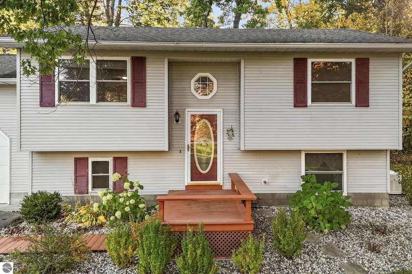 Set on over an acre in desirable Long Lake Township, this bi - Beach Home for sale in Traverse City, Michigan on Beachhouse.com