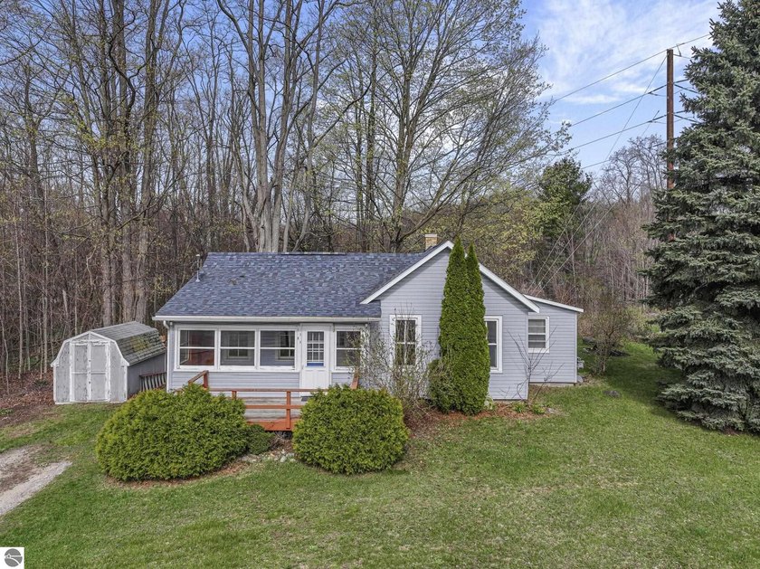 Positioned in the Village of Kewadin, this small but convenient - Beach Home for sale in Kewadin, Michigan on Beachhouse.com