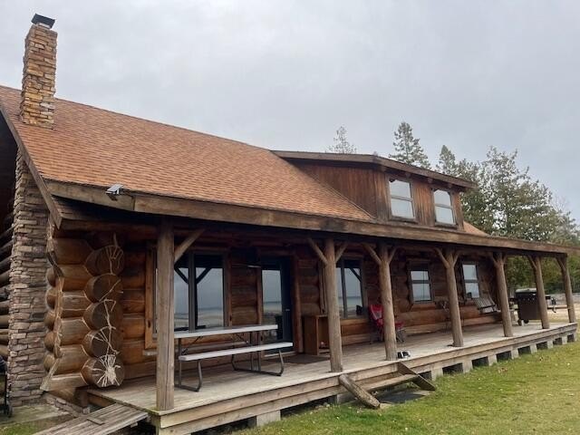 Beautiful Lake Huron setting and log home with multiple out - Beach Home for sale in Bois Blanc Island, Michigan on Beachhouse.com