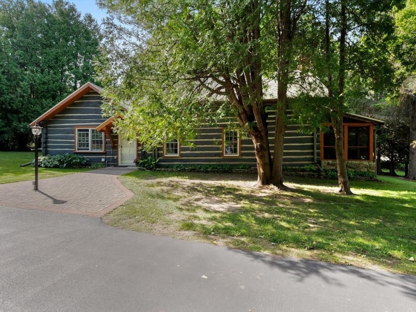 Built in 1854-55, this full-log home provides a natural coziness - Beach Home for sale in Baileys Harbor, Wisconsin on Beachhouse.com