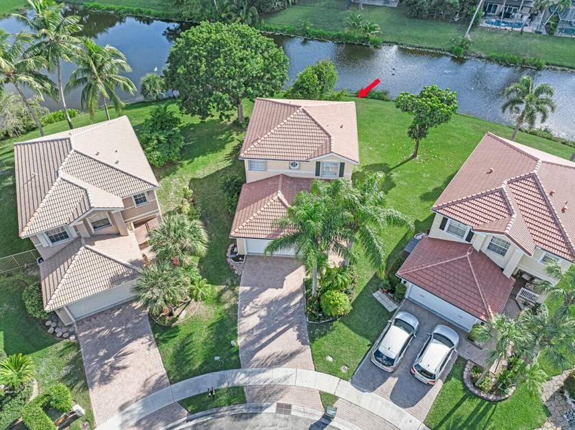 Discover this outstanding cul-de-sac waterfront  home with a - Beach Home for sale in Greenacres, Florida on Beachhouse.com