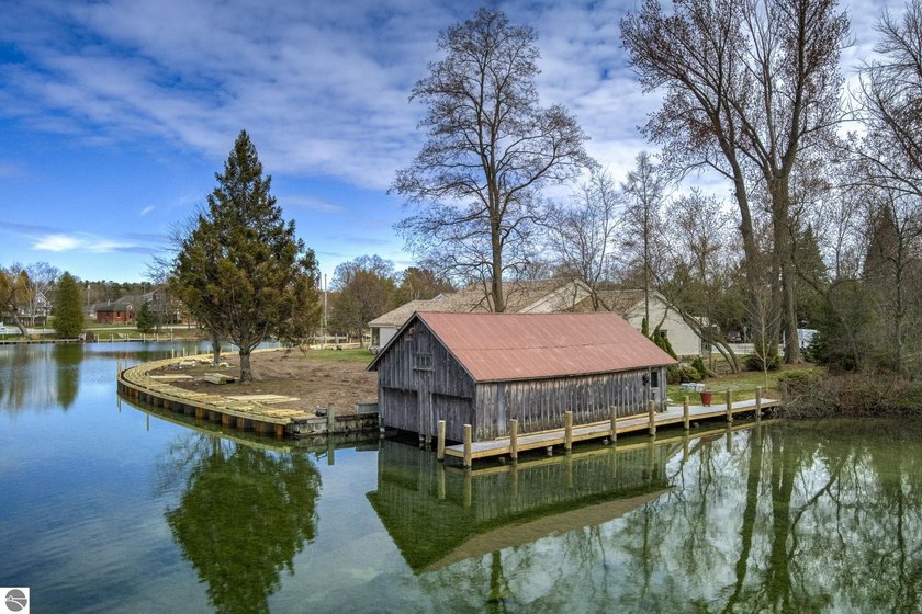 Nestled in the heart of Leland, this rare offering captures the - Beach Lot for sale in Leland, Michigan on Beachhouse.com