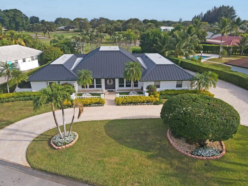 Nestled on an incredible 21,000 sq. ft. lot overlooking the - Beach Home for sale in Atlantis, Florida on Beachhouse.com