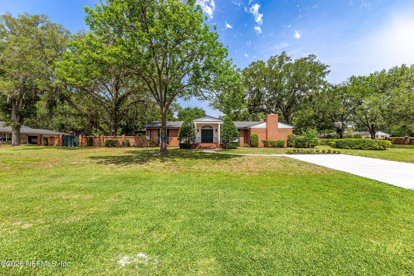 Set on a rare 0.62-acre corner lot beneath mature oaks in - Beach Home for sale in Jacksonville, Florida on Beachhouse.com