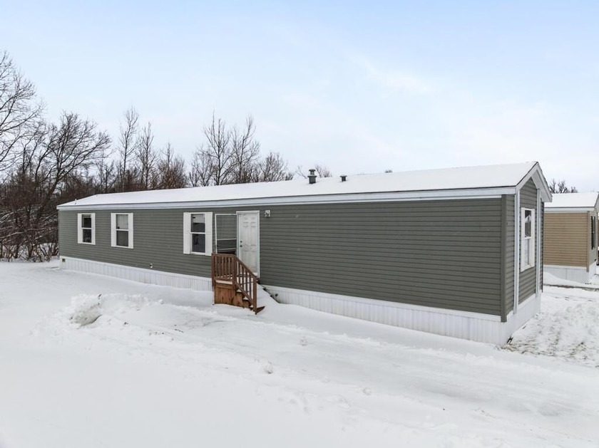 Located in the Conway Commons Community, this 2016 home offers - Beach Home for sale in Alanson, Michigan on Beachhouse.com