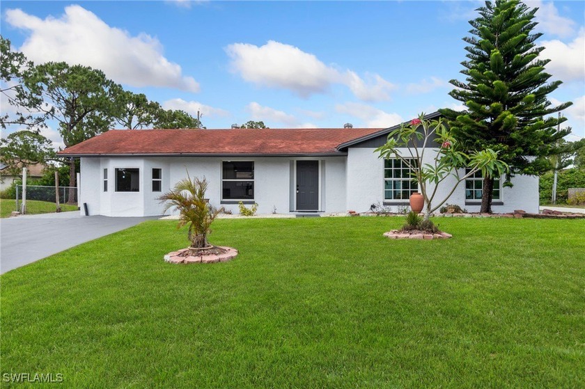 This beautifully renovated home that blends modern style with - Beach Home for sale in Lehigh Acres, Florida on Beachhouse.com