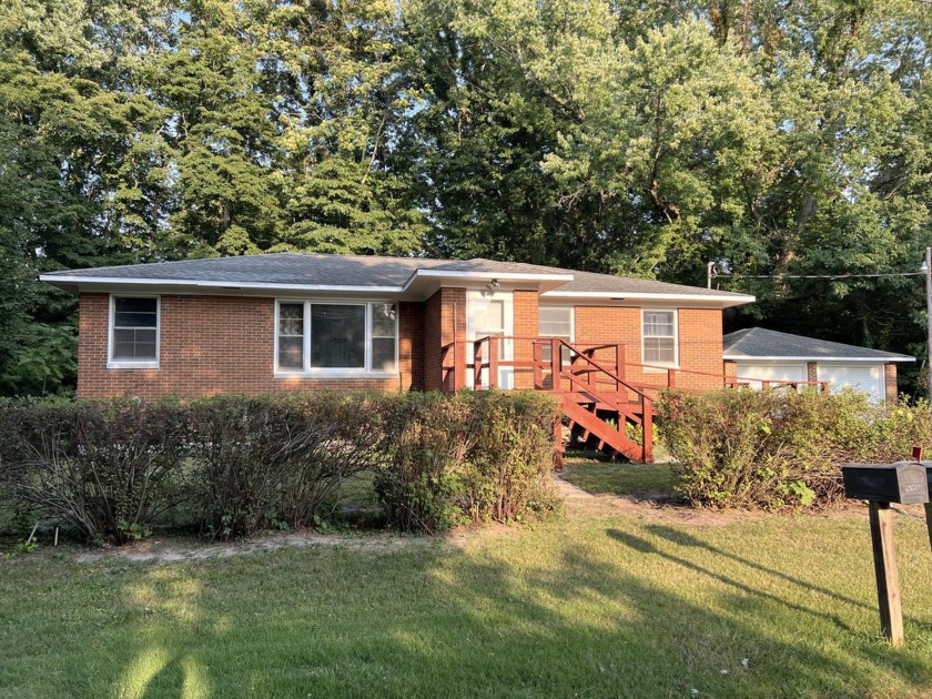 Charming 3-Bed, 1-Bath Brick Ranch! Nestled on a  3/4 -acre lot - Beach Home for sale in Coloma, Michigan on Beachhouse.com