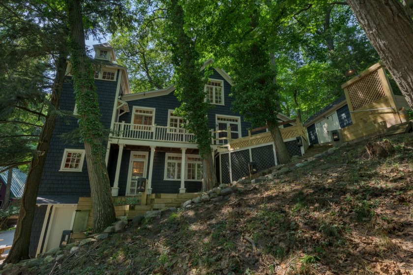 A charming cottage nestled into a sand dune, offering stunning - Beach Home for sale in Saugatuck, Michigan on Beachhouse.com