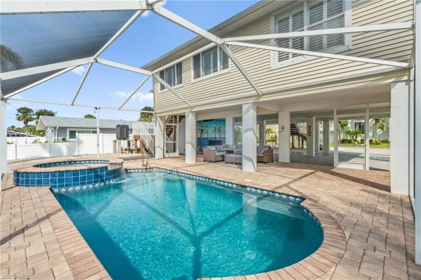 Welcome to your coastal paradise! This ELEVATED canal home with - Beach Home for sale in Fort Myers Beach, Florida on Beachhouse.com