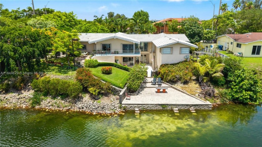 Beyond the buzz of the road lies a hidden sanctuary where time - Beach Home for sale in Miami, Florida on Beachhouse.com