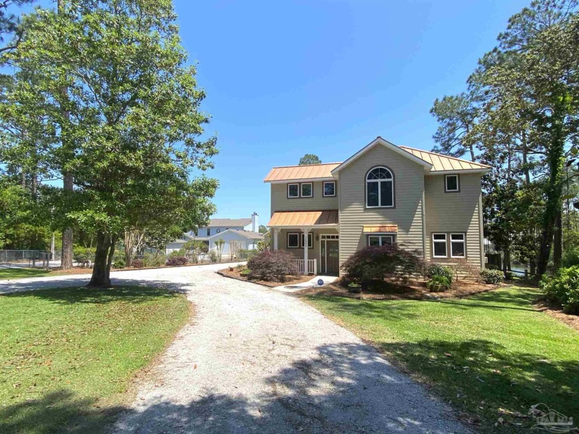 Step into waterfront paradise with this spectacular listing on - Beach Home for sale in Elberta, Alabama on Beachhouse.com