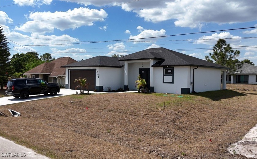 Welcome to this stunning new construction 2025 on a large lot in - Beach Home for sale in Lehigh Acres, Florida on Beachhouse.com