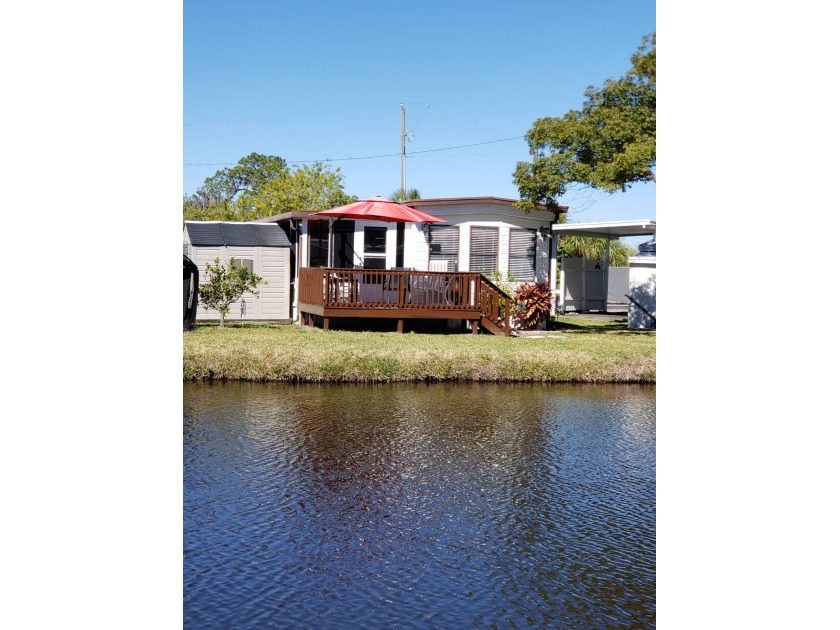 Enjoy the quiet setting on the deck overlooking the pond and - Beach Home for sale in Ruskin, Florida on Beachhouse.com