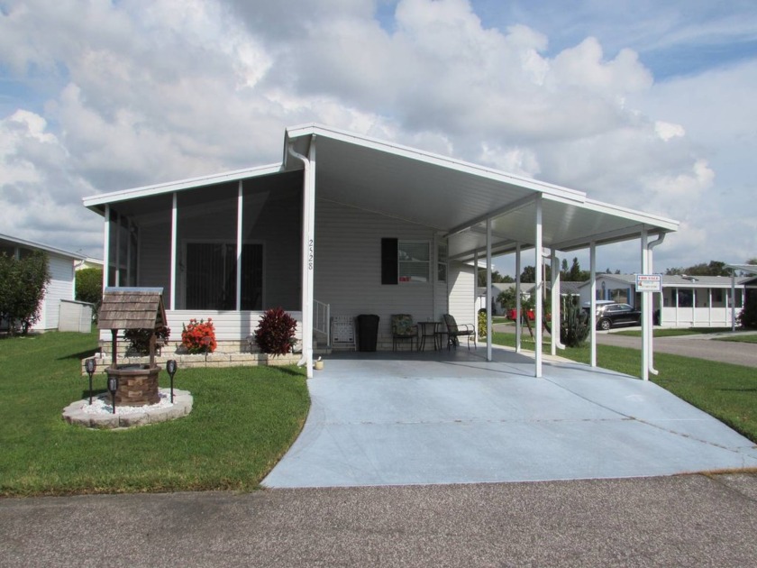 CORNER PROPERTY WELL MAINTAINED FURNISHED 2 BED 2 BATH JACOBSEN - Beach Home for sale in Trinity, Florida on Beachhouse.com