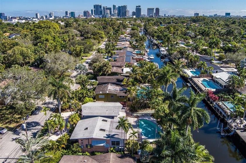 Make this tranquil canal front home your own! This tri-level - Beach Home for sale in Fort Lauderdale, Florida on Beachhouse.com