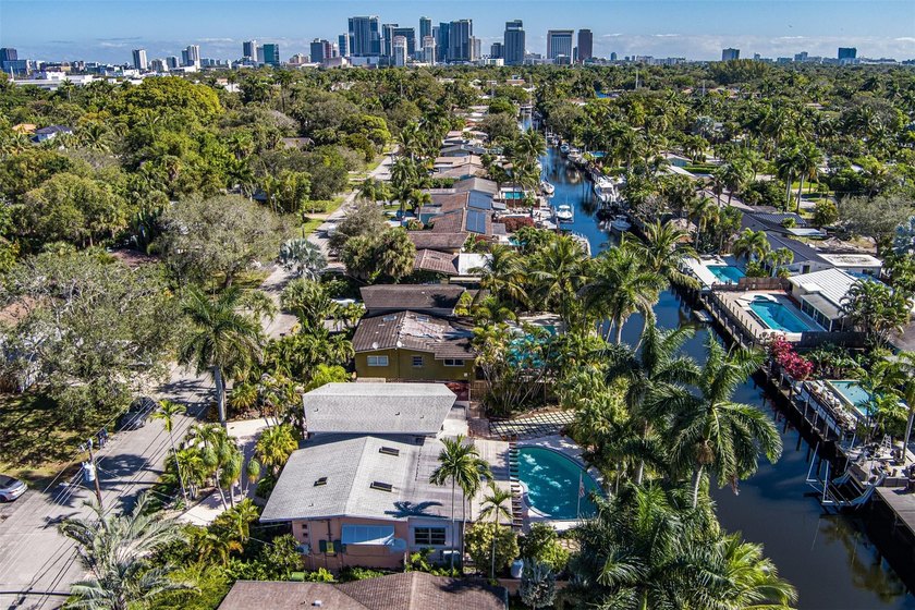 Make this tranquil canal front home your own! This tri-level - Beach Home for sale in Fort Lauderdale, Florida on Beachhouse.com