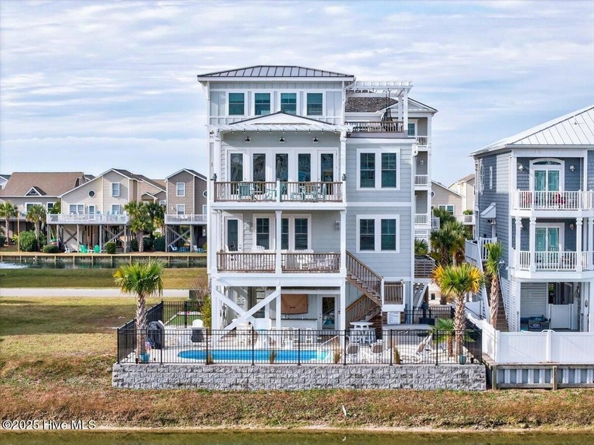 Discover the magic of refined coastal luxury at 148 Via Old - Beach Home for sale in Ocean Isle Beach, North Carolina on Beachhouse.com