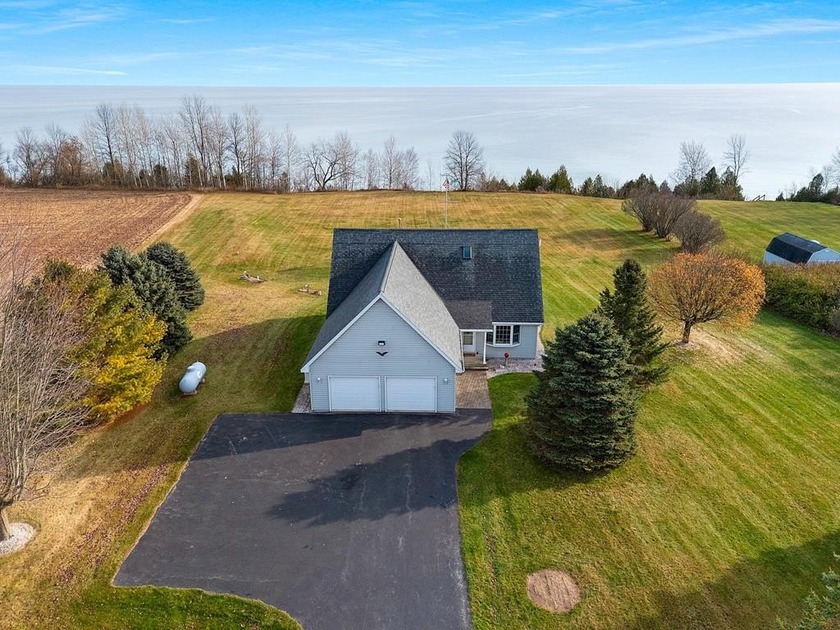 Discover this lovingly maintained 1.5-story colonial with rare - Beach Home for sale in Kewaunee, Wisconsin on Beachhouse.com