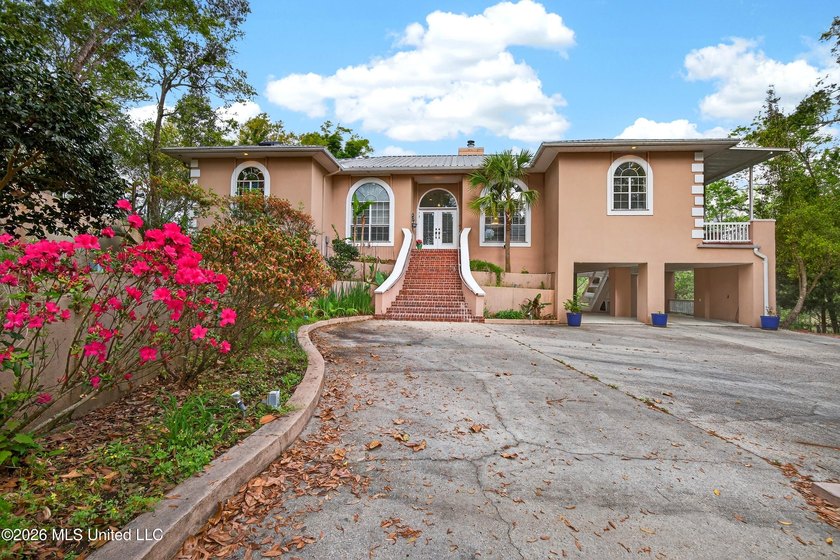 WELCOME to this stunning mediterranean residence located on 2 - Beach Home for sale in Diamondhead, Mississippi on Beachhouse.com