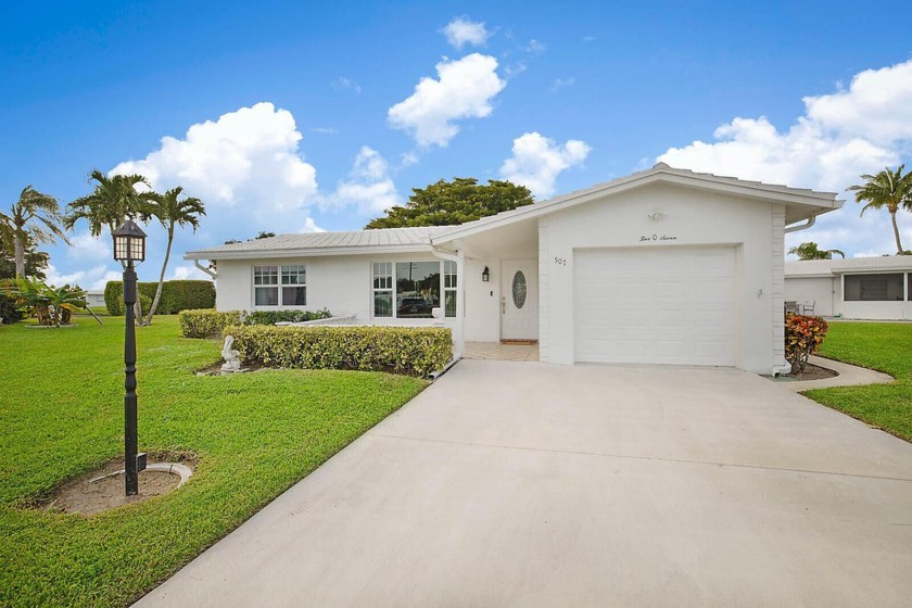 This stunning waterfront retreat in a vibrant 55+ community is - Beach Home for sale in Boynton Beach, Florida on Beachhouse.com