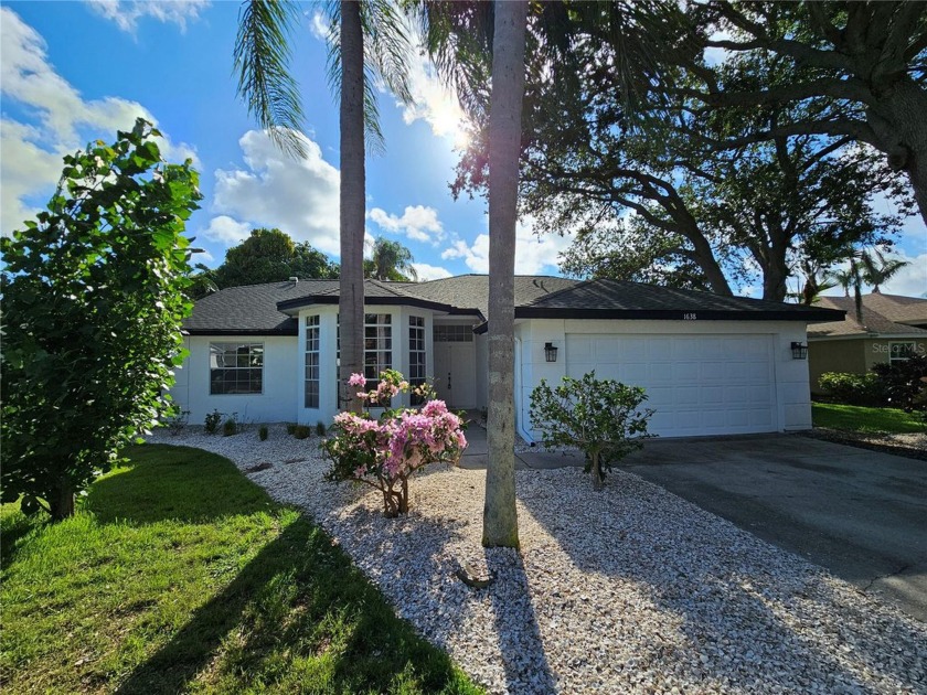 Step into this stunning split-floor plan residence and be - Beach Home for sale in Tarpon Springs, Florida on Beachhouse.com